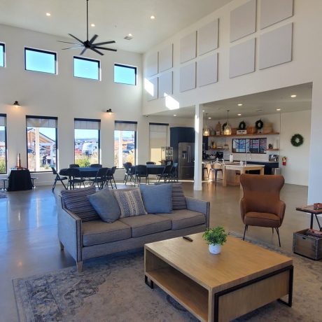 A modern clubhouse with comfortable seating and recreational areas at Southern Utah RV Resort near St. George, Utah.