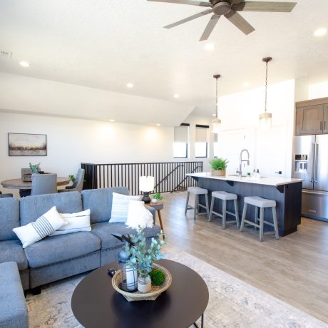 Spacious living room with modern amenities and comfortable seating in the Desert Loft at Southern Utah RV Resort near St. George, Utah.