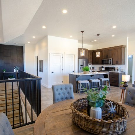 Spacious living room with modern amenities and comfortable seating in the Desert Loft at Southern Utah RV Resort near St. George, Utah.